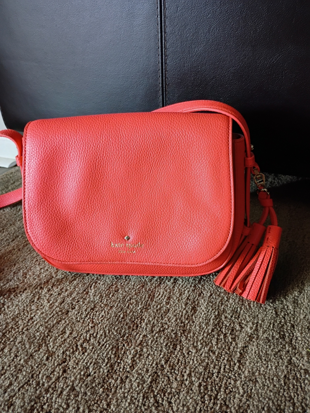 kate spade coral pebbled leather crossbody with tassel